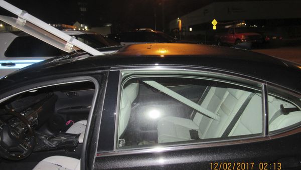 A photo provided by the South Hackensack Police Department shows a car with a mass transit sign sticking out of the roof. - Sputnik International