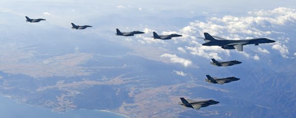 In this photo provided by South Korea Defense Ministry, U.S. Air Force B-1B bomber, right top, flies over the Korean Peninsula with South Korean fighter jets and U.S. fighter jets during the combined aerial exercise, South Korea, Wednesday, Dec. 6, 2017 In this photo provided by South Korea Defense Ministry, U.S. Air Force B-1B bomber, right top, flies over the Korean Peninsula with South Korean fighter jets and U.S. fighter jets during the combined aerial exercise, South Korea, Wednesday, Dec. 6, 2017 - Sputnik International