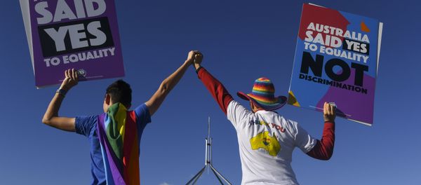 Same-sex marriage campaigners pose for pictures during an equality rally outside Parliament House in Canberra December 7, 2017 Same-sex marriage campaigners pose for pictures during an equality rally outside Parliament House in Canberra December 7, 2017 - Sputnik International