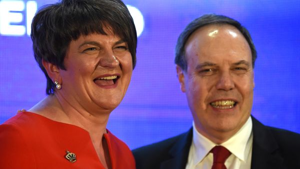 DUP leader Arlene Foster and deputy leader Nigel Dodds are seen after Arlene Fosters speech at her party's annual conference in Belfast, Northern Ireland, November 25, 2017. DUP leader Arlene Foster and deputy leader Nigel Dodds are seen after Arlene Fosters speech at her party's annual conference in Belfast, Northern Ireland, November 25, 2017. - Sputnik International