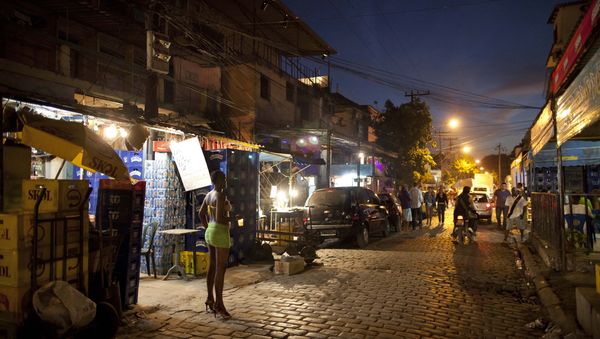 In this photo taken May 25, 2011, A sex worker waits for customers at the Vila Mimosa prostitution zone in Rio de Janeiro, Brazil In this photo taken May 25, 2011, A sex worker waits for customers at the Vila Mimosa prostitution zone in Rio de Janeiro, Brazil - Sputnik International