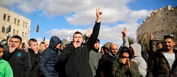 Palestinians shout slogans during a protest following U.S. President Donald Trump's announcement that he has recognized Jerusalem as Israel's capital, near Damascus Gate in Jerusalem's Old City December 7, 2017 - Sputnik International