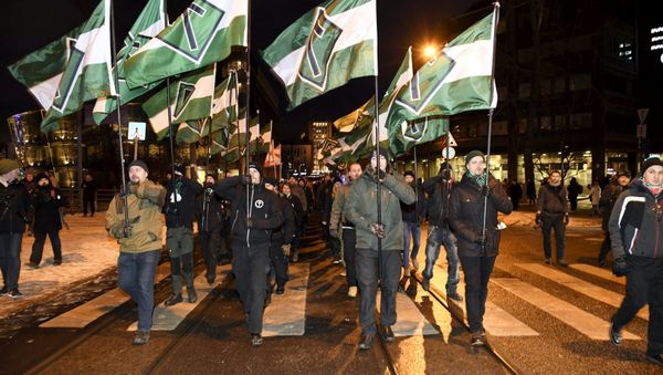 Members of far right group Nordic Resistance Movement march during the festivities of the centenary of Finnish independence in Helsinki, Finland on December 6, 2017 - Sputnik International