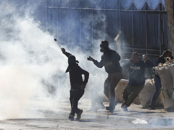 Palestinians clash with Israeli troops during a protest against U.S. President Donald Trump's decision to recognize Jerusalem as the capital of Israel in the West Bank city of Bethlehem, Friday, Dec.8, 2017 - Sputnik International