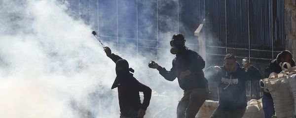 Palestinians clash with Israeli troops during a protest against U.S. President Donald Trump's decision to recognize Jerusalem as the capital of Israel in the West Bank city of Bethlehem, Friday, Dec.8, 2017 - Sputnik International