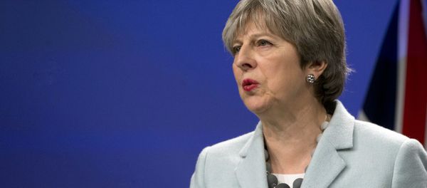 British Prime Minister Theresa May speaks during a media conference with European Commission President Jean-Claude Juncker at EU headquarters in Brussels on Friday, Dec. 8, 2017. - Sputnik International