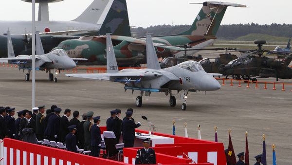 Two F-15 J/DJ fighter planes make their way on a runway during the annual air review at Hyakuri Air Base, north of Tokyo. (File) Two F-15 J/DJ fighter planes make their way on a runway during the annual air review at Hyakuri Air Base, north of Tokyo. (File) - Sputnik International