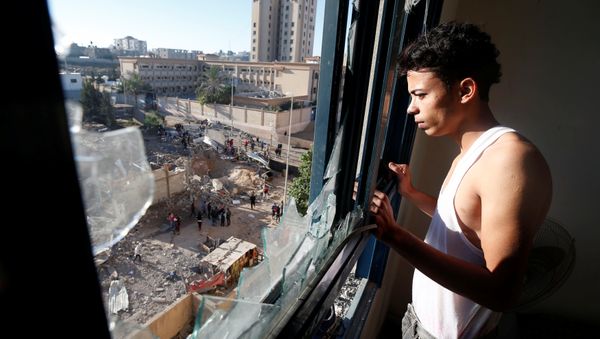 A Palestinian man looks out of his apartment that was damaged in an Israeli airstrike on a nearby militant target in the northern Gaza Strip December 9, 2017 A Palestinian man looks out of his apartment that was damaged in an Israeli airstrike on a nearby militant target in the northern Gaza Strip December 9, 2017 - Sputnik International