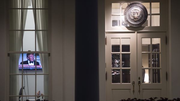 An image of US President Donald Trump appears on a television screen inside the West Wing of the White House in Washington, DC, May 15, 2017 - Sputnik International