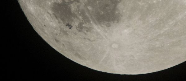 The International Space Station, with a crew of six onboard, is seen in silhouette as it transits the Moon on Saturday, Dec. 2, 2017, in Manchester Township, York County, Pa The International Space Station, with a crew of six onboard, is seen in silhouette as it transits the Moon on Saturday, Dec. 2, 2017, in Manchester Township, York County, Pa - Sputnik International