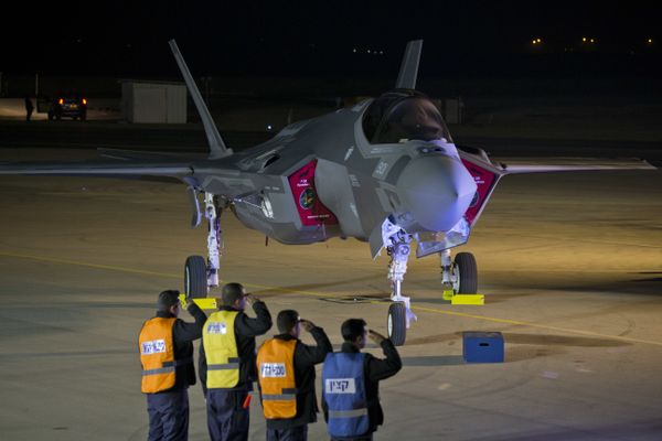 Israeli air force officers salute toward one of the first two next-generation F-35 fighter jets during an unveiling ceremony after it landed in Nevatim Air Force base near Beersheba, Southern Israel, Monday, Dec. 12, 2016 Israeli air force officers salute toward one of the first two next-generation F-35 fighter jets during an unveiling ceremony after it landed in Nevatim Air Force base near Beersheba, Southern Israel, Monday, Dec. 12, 2016 - Sputnik International