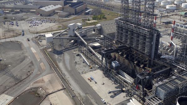 In this Sept. 21, 2017 photo, petroleum coke, the grainy black byproduct of refining Canadian tar sands oil, is visible at the BP Whiting refinery in East Chicago, Ind.  - Sputnik International