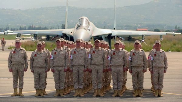 Servicemen are seen here at the Russian air base in Khmeimim during a military parade marking the 72nd anniversary of Victory in the 1941-45 Great Patriotic War. File photo - Sputnik International