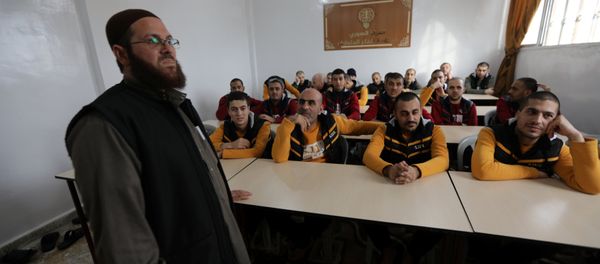 Former Islamic State members sit in a classroom at the Syrian Center for Combating Extremist Ideology in the town of Marea in northern Aleppo countryside, Syria, November 2, 2017. Picture taken November 2, 2017 - Sputnik International