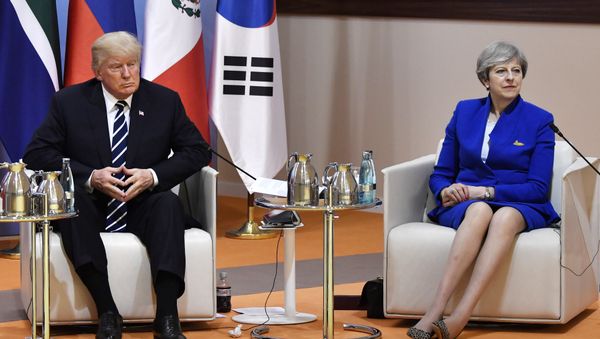 US President Donald Trump and Britain's Prime Minister Theresa May sit at the start of the retreat meeting on the first day of the G-20 summit in Hamburg, northern Germany, on Friday July 7, 2017. - Sputnik International