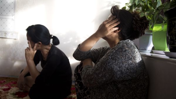In this photo taken Friday, Sept. 8, 2017, North Korean women react during a meeting in a home near the city of Chaoyang in northeastern China's Liaoning province - Sputnik International