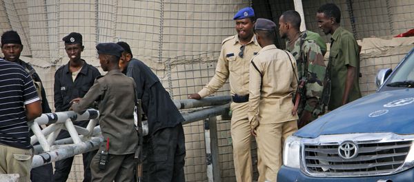 Somali police guard the road leading to the scene of a suicide bomb attack on a police academy in the capital Mogadishu, Somalia Thursday, Dec. 14, 2017 Somali police guard the road leading to the scene of a suicide bomb attack on a police academy in the capital Mogadishu, Somalia Thursday, Dec. 14, 2017 - Sputnik International