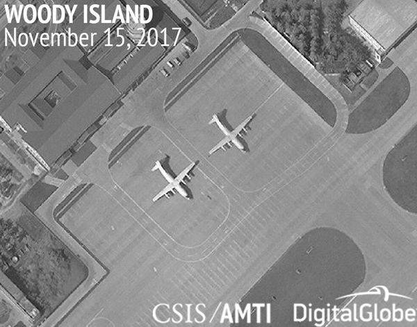 This image provided by CSIS Asia Maritime Transparency Initiative/DigitalGlobe shows a satellite image of Woody Island in the Paracel island chain in the South China Sea taken Nov. 15, 2017, and annotated by the source, showing two Chinese Y-8 military transport aircraft - Sputnik International