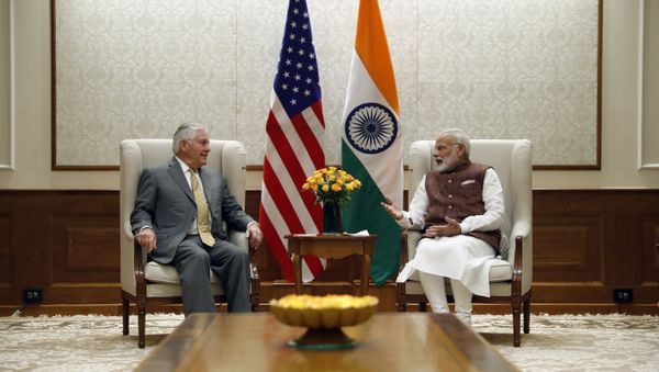 US Secretary of State Rex Tillerson (L) listens to Indian Prime Minister Narendra Modi at the Prime Minister's residence in New Delhi - Sputnik International