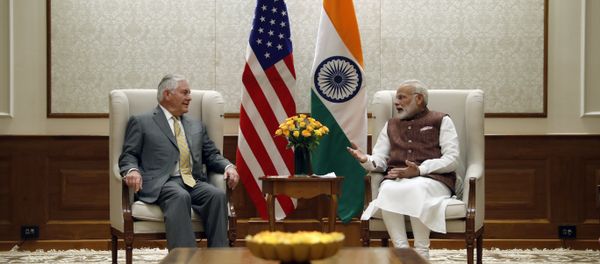 US Secretary of State Rex Tillerson (L) listens to Indian Prime Minister Narendra Modi at the Prime Minister's residence in New Delhi - Sputnik International