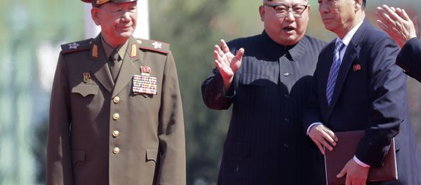 North Korean leader Kim Jong Un, center, speaks with Pak Pong Ju, right, and Hwang Pyong So, left, during the opening ceremony of the Ryomyong residential area, a collection of more than a dozen apartment buildings, on Thursday, April 13, 2017, in Pyongyang, North Korea. North Korean leader Kim Jong Un, center, speaks with Pak Pong Ju, right, and Hwang Pyong So, left, during the opening ceremony of the Ryomyong residential area, a collection of more than a dozen apartment buildings, on Thursday, April 13, 2017, in Pyongyang, North Korea. - Sputnik International