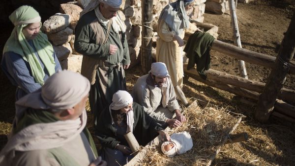 Christian actors play the parts of Joseph and Mary during a re-enactment of a Nativity scene of the birth of Jesus Christ as part of Christmas festivities at the Nazareth Village in the northern Israeli city of Nazareth, Tuesday, Dec. 20, 2016 - Sputnik International