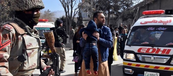 A man carries a boy as he shouts for an ambulance after gunmen attacked the Bethel Memorial Methodist Church in Quetta, Pakistan December 17, 2017 A man carries a boy as he shouts for an ambulance after gunmen attacked the Bethel Memorial Methodist Church in Quetta, Pakistan December 17, 2017 - Sputnik International