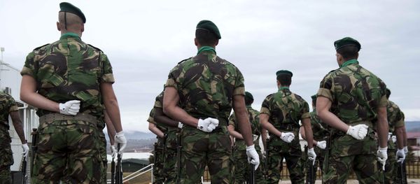 Portuguese soldiers serving in the North Atlantic Treaty Organization (NATO) led peacekeeping mission in Kosovo (KFOR) stand at attention before the arrival of the NATO secretary general during his visit to Pristina on January 23, 2015 Portuguese soldiers serving in the North Atlantic Treaty Organization (NATO) led peacekeeping mission in Kosovo (KFOR) stand at attention before the arrival of the NATO secretary general during his visit to Pristina on January 23, 2015 - Sputnik International