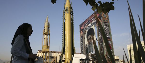 a Ghadr-H missile, center, a solid-fuel surface-to-surface Sejjil missile and a portrait of the Supreme Leader Ayatollah Ali Khamenei are displayed at Baharestan Square in Tehran, Iran - Sputnik International