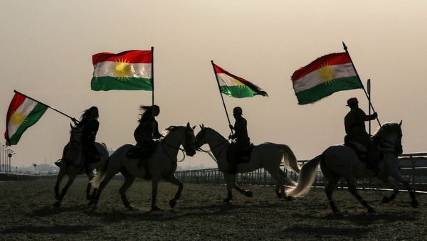 Iraqi Kurdish horsemen ride carrying Kurdish flags celebrating their flag day in the northern city of Arbil, the capital of the autonomous Kurdish region in northern Iraq Iraqi Kurdish horsemen ride carrying Kurdish flags celebrating their flag day in the northern city of Arbil, the capital of the autonomous Kurdish region in northern Iraq - Sputnik International