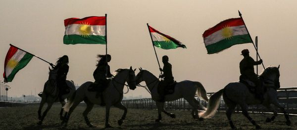 Iraqi Kurdish horsemen ride carrying Kurdish flags celebrating their flag day in the northern city of Arbil, the capital of the autonomous Kurdish region in northern Iraq Iraqi Kurdish horsemen ride carrying Kurdish flags celebrating their flag day in the northern city of Arbil, the capital of the autonomous Kurdish region in northern Iraq - Sputnik International