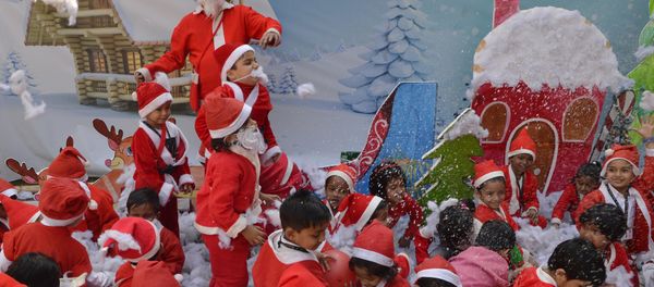 Indian school children dressed as Santa Claus take part in a Christmas event at a school in Siliguri - Sputnik International