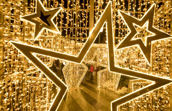 A man walks by a large Christmas decoration panel at the Christmas market in Sankt Poelten, Austria - Sputnik International