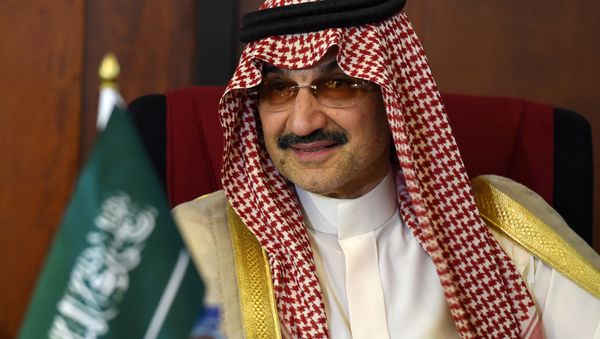 Saudi Arabian royal Al-Waleed Bin Talal bin Abdulaziz al Saud looks on during a meeting with Sri Lankan Foreign Minister Ravi Karunanayake in Colombo on July 4, 2017 - Sputnik International