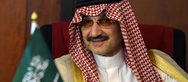Saudi Arabian royal Al-Waleed Bin Talal bin Abdulaziz al Saud looks on during a meeting with Sri Lankan Foreign Minister Ravi Karunanayake in Colombo on July 4, 2017 - Sputnik International