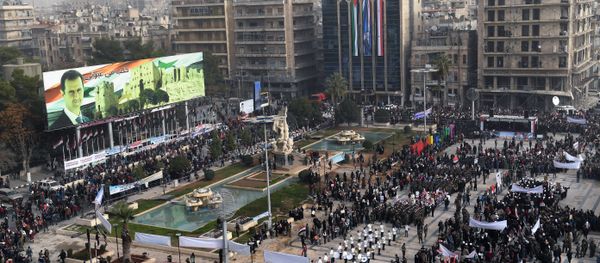A picture taken on December 21, 2017 shows an elevated view of the square of Saadallah al-Jabiri as marching bands, soldiers, and civilians gather in a government celebration marking the first anniversary of the retaking of the second Syrian city of Aleppo A picture taken on December 21, 2017 shows an elevated view of the square of Saadallah al-Jabiri as marching bands, soldiers, and civilians gather in a government celebration marking the first anniversary of the retaking of the second Syrian city of Aleppo - Sputnik International