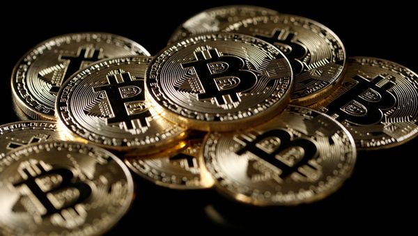 A collection of Bitcoin (virtual currency) tokens are displayed in this picture illustration taken December 8, 2017 A collection of Bitcoin (virtual currency) tokens are displayed in this picture illustration taken December 8, 2017 - Sputnik International
