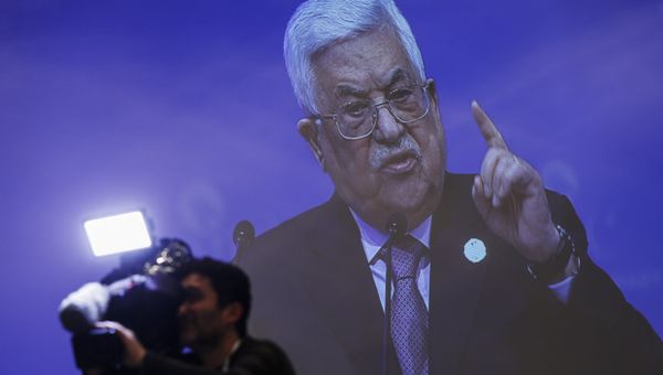 A cameraman works at the press centre, backdropped by a live broadcast of Palestinian President Mahmoud Abbas addressing the Organisation of Islamic Cooperation's Extraordinary Summit in Istanbul, Wednesday, Dec. 13, 2017. Abbas said the Palestinians won't accept any role for the United States in a peace process with Israel from now on after the U.S President Donald Trump administration's decision to recognise Jerusalem as the capital of the Jewish state. Abbas said Trump's decision was a crime that threatens world peace. - Sputnik International