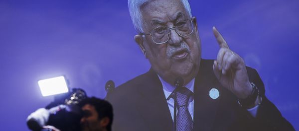 A cameraman works at the press centre, backdropped by a live broadcast of Palestinian President Mahmoud Abbas addressing the Organisation of Islamic Cooperation's Extraordinary Summit in Istanbul, Wednesday, Dec. 13, 2017. Abbas said the Palestinians won't accept any role for the United States in a peace process with Israel from now on after the U.S President Donald Trump administration's decision to recognise Jerusalem as the capital of the Jewish state. Abbas said Trump's decision was a crime that threatens world peace. A cameraman works at the press centre, backdropped by a live broadcast of Palestinian President Mahmoud Abbas addressing the Organisation of Islamic Cooperation's Extraordinary Summit in Istanbul, Wednesday, Dec. 13, 2017. Abbas said the Palestinians won't accept any role for the United States in a peace process with Israel from now on after the U.S President Donald Trump administration's decision to recognise Jerusalem as the capital of the Jewish state. Abbas said Trump's decision was a crime that threatens world peace. - Sputnik International