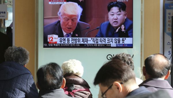 FILE- In this Tuesday, Nov. 21, 2017, file photo, people watch a TV screen showing images of U.S. President Donald Trump, left, and North Korean leader Kim Jong Un at Seoul Railway Station in Seoul, South Korea FILE- In this Tuesday, Nov. 21, 2017, file photo, people watch a TV screen showing images of U.S. President Donald Trump, left, and North Korean leader Kim Jong Un at Seoul Railway Station in Seoul, South Korea - Sputnik International