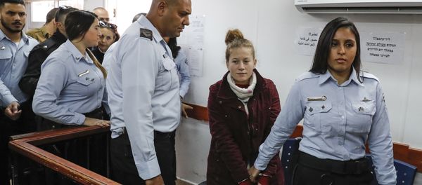 Ahed Tamimi (2nd-R), a prominent 17-year-old Palestinian campaigner against Israel's occupation, appears at a military court at the Israeli-run Ofer prison in the West Bank village of Betunia on December 25, 2017 Ahed Tamimi (2nd-R), a prominent 17-year-old Palestinian campaigner against Israel's occupation, appears at a military court at the Israeli-run Ofer prison in the West Bank village of Betunia on December 25, 2017 - Sputnik International