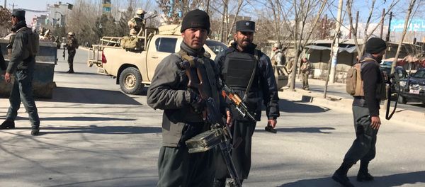 Afghan policemen stand guard at the site of a blast in Kabul, Afghanistan December 28, 2017 - Sputnik International
