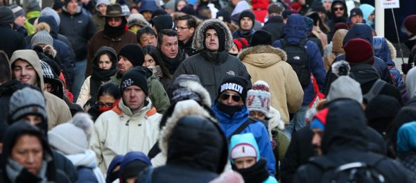 People bundle up against the cold temperature as they walk in Times Square in Manhattan, New York, U.S., December 28, 2017 People bundle up against the cold temperature as they walk in Times Square in Manhattan, New York, U.S., December 28, 2017 - Sputnik International
