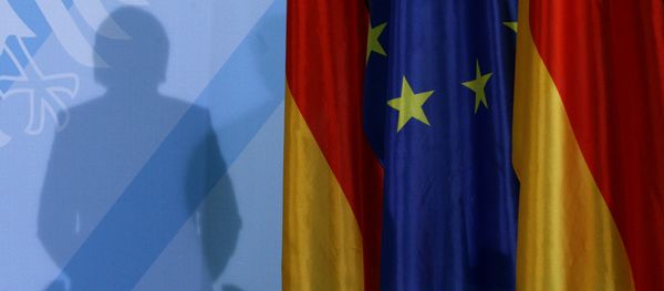 The shadow of German Chancellor Angela Merkel photographed as she addresses the media after a meeting with German parliament floor leaders about the European Union bail-out in Berlin, Monday, May 10, 2010. - Sputnik International