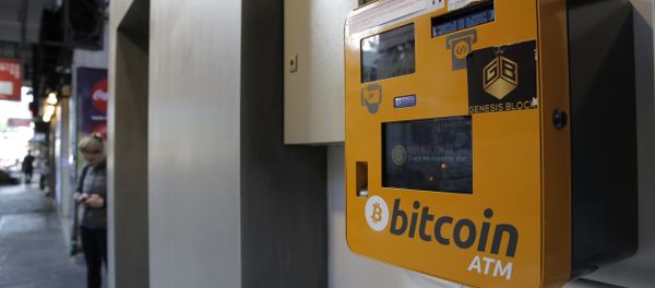 A Bitcoin ATM is placed in a public area in Hong Kong, Thursday, Dec. 21, 2017. Bitcoin is the world's most popular virtual currency. Such currencies are not tied to a bank or government and allow users to spend money anonymously. They are basically lines of computer code that are digitally signed each time they are traded. A Bitcoin ATM is placed in a public area in Hong Kong, Thursday, Dec. 21, 2017. Bitcoin is the world's most popular virtual currency. Such currencies are not tied to a bank or government and allow users to spend money anonymously. They are basically lines of computer code that are digitally signed each time they are traded. - Sputnik International