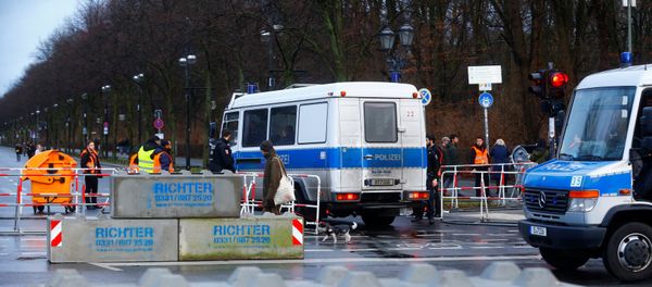 Security and Police stand beside concrete barriers near the Brandenburg Gate, ahead of the upcoming New Year's Eve celebrations in Berlin, Germany, December 31, 2017 Security and Police stand beside concrete barriers near the Brandenburg Gate, ahead of the upcoming New Year's Eve celebrations in Berlin, Germany, December 31, 2017 - Sputnik International