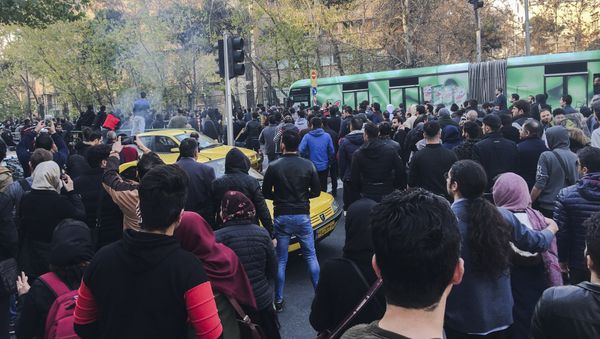 This photo taken by an individual not employed by the Associated Press and obtained by the AP outside Iran, demonstrators attend a protest over Iran's weak economy, in Tehran, Iran, Saturday, Dec. 30, 2017 This photo taken by an individual not employed by the Associated Press and obtained by the AP outside Iran, demonstrators attend a protest over Iran's weak economy, in Tehran, Iran, Saturday, Dec. 30, 2017 - Sputnik International