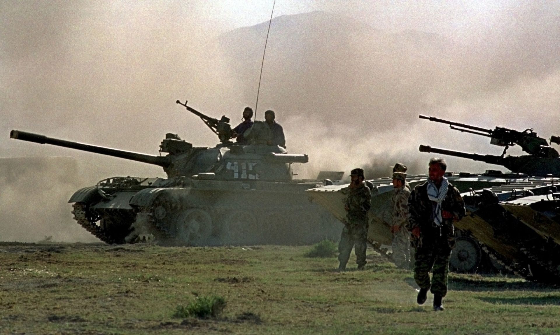 Northern alliance armor warm up their engines, during preparations for an offensive against Afghanistan's Taliban movement in Takhar province, some 15 km (9 miles) from the Tajik-Afghan border in Afghanistan, Thursday, Oct. 4, 2001. The opposition alliance in northern Afghanistan is coordinating its offensive with the United States, an opposition spokesman said Wednesday, and it is expecting fresh arms deliveries from two of its strongest allies in the fight against the Taliban: Iran and Russia. Northern alliance armor warm up their engines, during preparations for an offensive against Afghanistan's Taliban movement in Takhar province, some 15 km (9 miles) from the Tajik-Afghan border in Afghanistan, Thursday, Oct. 4, 2001. The opposition alliance in northern Afghanistan is coordinating its offensive with the United States, an opposition spokesman said Wednesday, and it is expecting fresh arms deliveries from two of its strongest allies in the fight against the Taliban: Iran and Russia. - Sputnik International, 1920, 14.10.2021