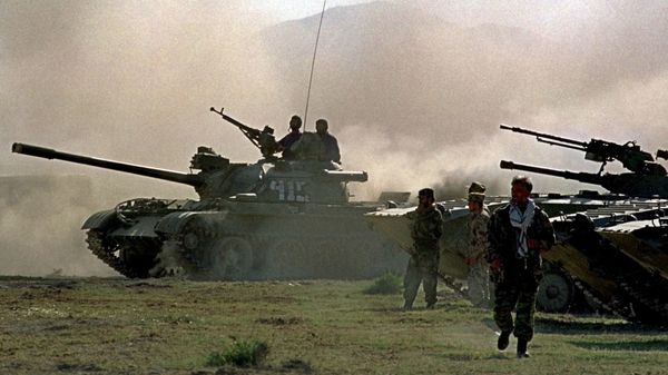 Northern alliance armor warm up their engines, during preparations for an offensive against Afghanistan's Taliban movement in Takhar province, some 15 km (9 miles) from the Tajik-Afghan border in Afghanistan, Thursday, Oct. 4, 2001. The opposition alliance in northern Afghanistan is coordinating its offensive with the United States, an opposition spokesman said Wednesday, and it is expecting fresh arms deliveries from two of its strongest allies in the fight against the Taliban: Iran and Russia. - Sputnik International