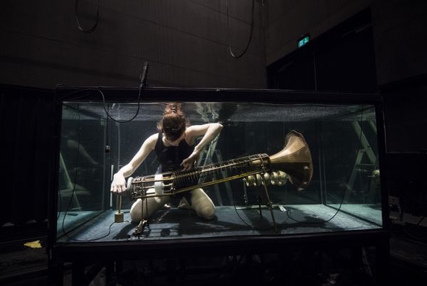 A member of the Between Music band, performs with a custom-made instrument in a glass water tank during a rehearsal ahead of the AquaSonic underwater concert on April 19, 2017 in Aarhus, Denmark A member of the Between Music band, performs with a custom-made instrument in a glass water tank during a rehearsal ahead of the AquaSonic underwater concert on April 19, 2017 in Aarhus, Denmark - Sputnik International